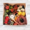 Chic (Serves 2–3): Includes 2 artisanal cheeses, 1 cured meat, fresh fruit, nuts, honey or jam, olives, crackers, and a sweet treat. Tray or container is subject to availability and may vary in shape and material. Wooden boards available for rent.